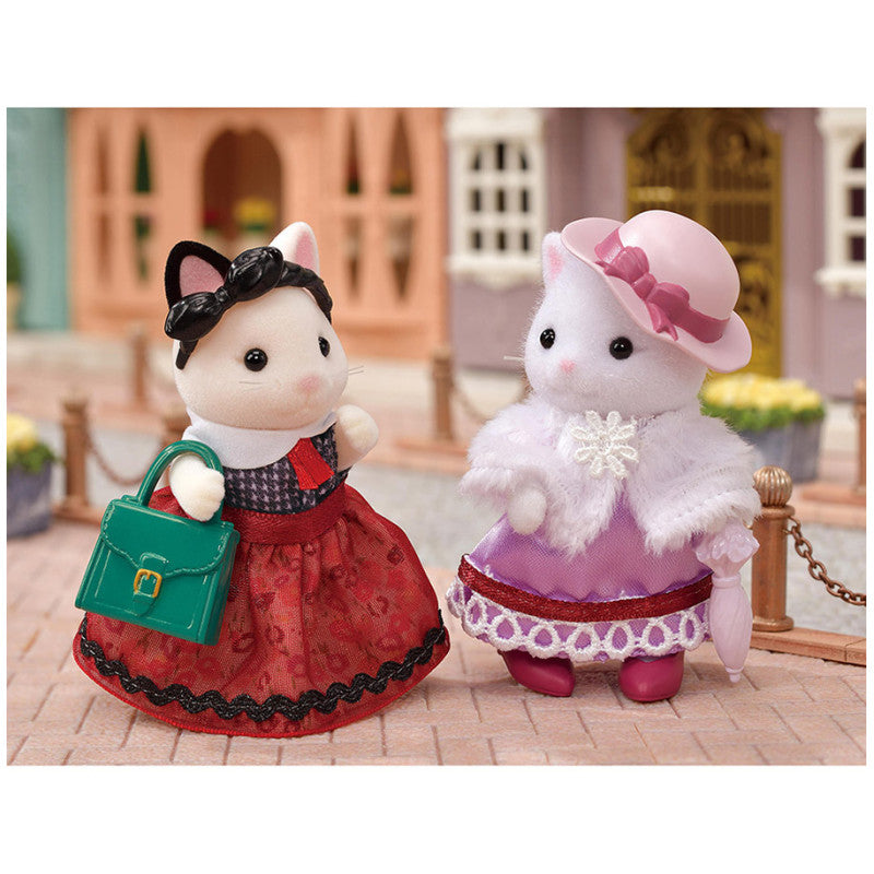La valisette de mode et la grande sœur Chat Bicolore